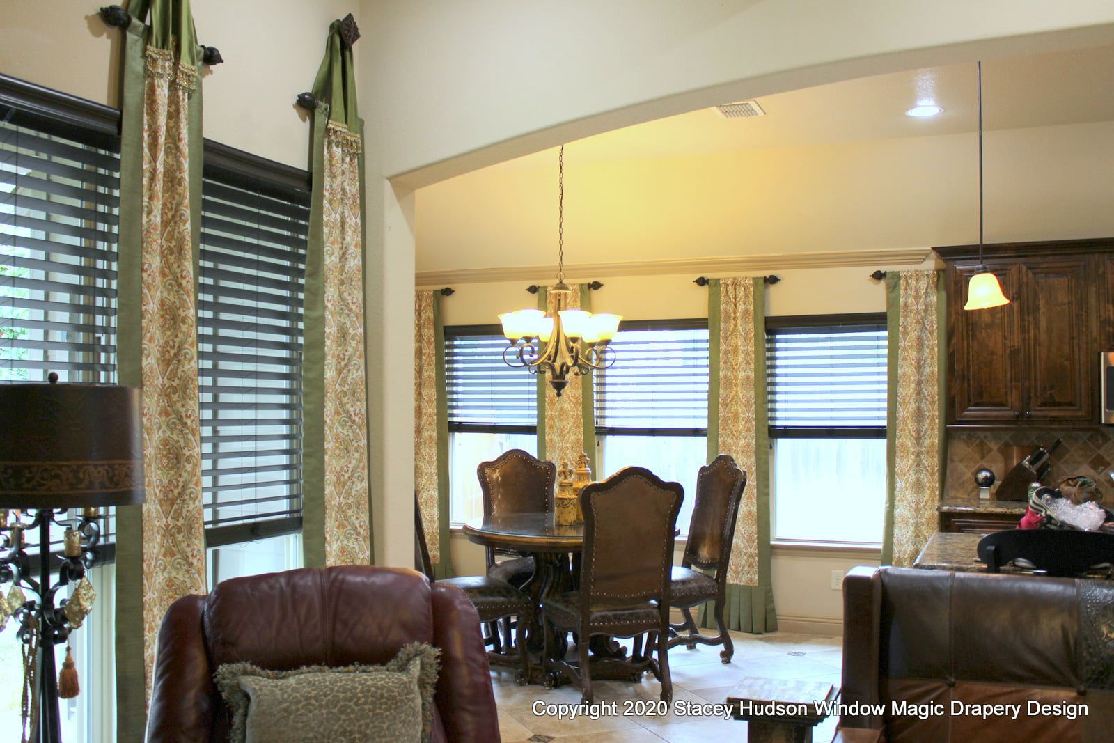 A living room with a dining room table and chairs