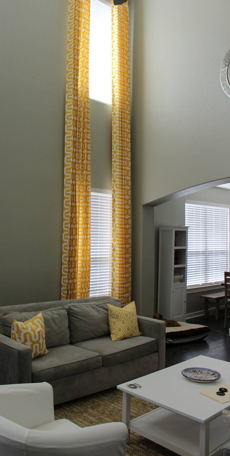 A living room with a couch , chair and coffee table.