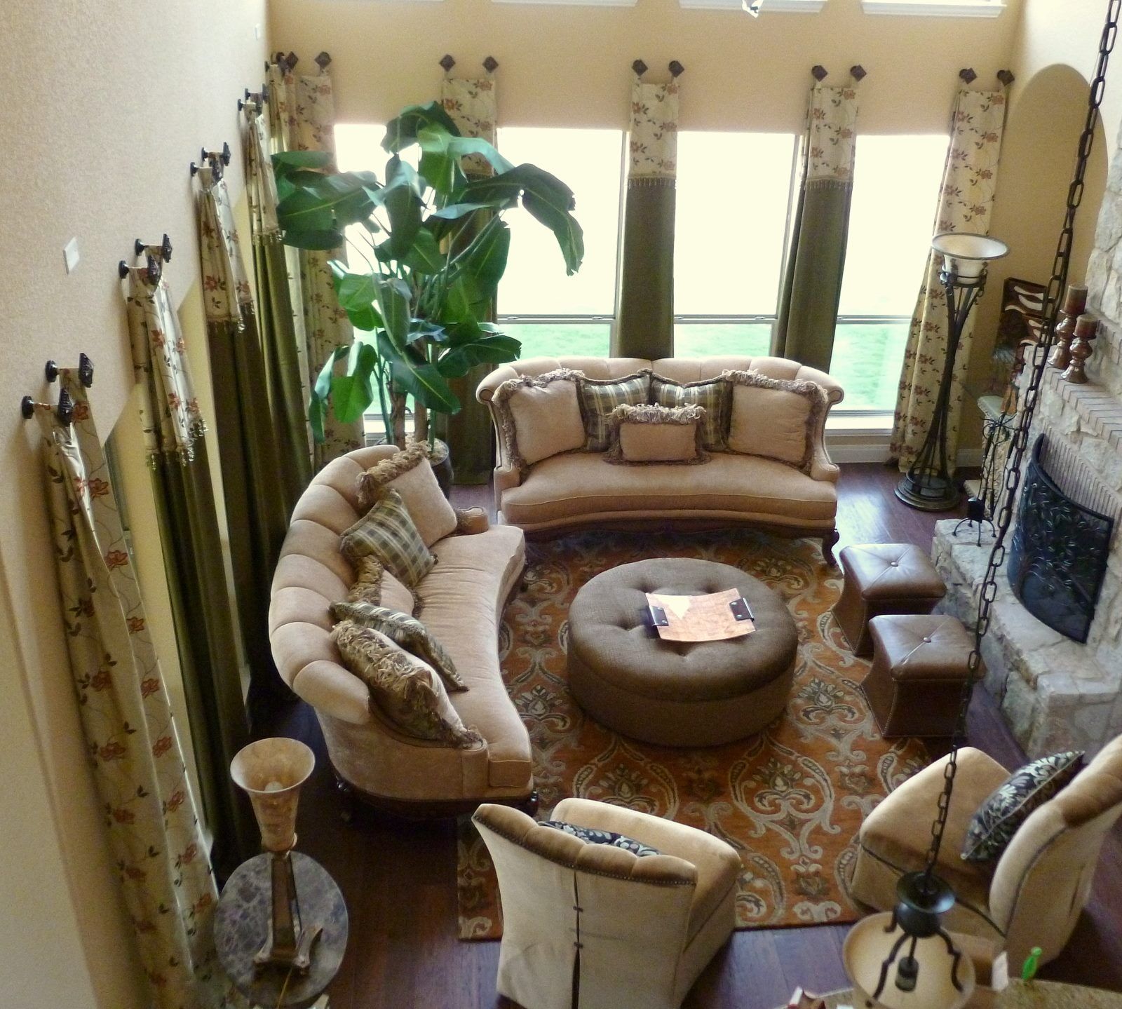 An aerial view of a living room with furniture and a fireplace