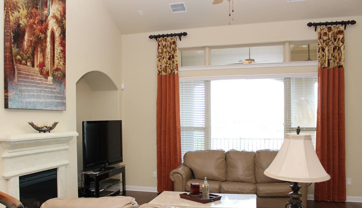 A living room with a couch and a fireplace