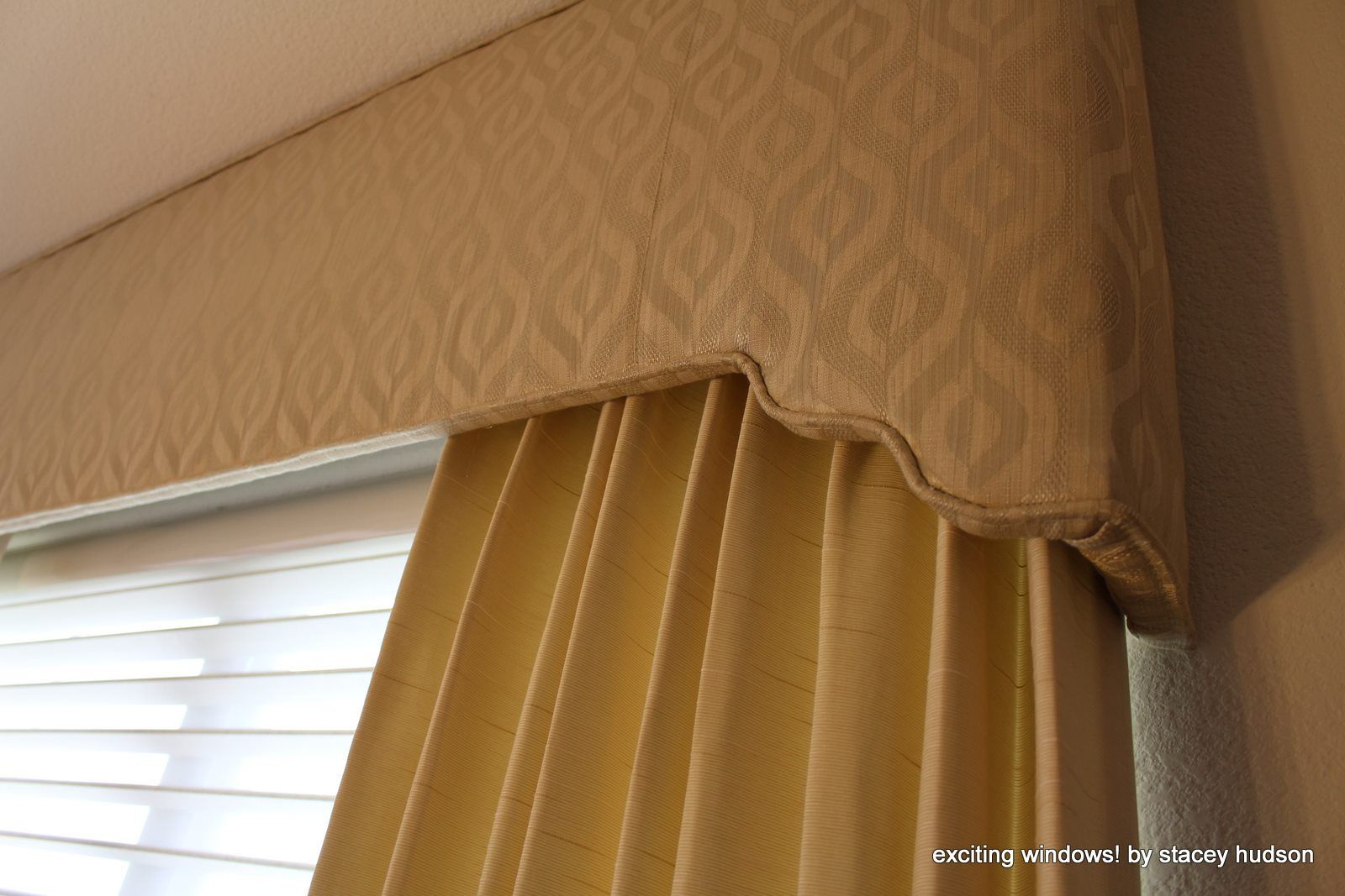 A close up of a curtain with a geometric pattern on it