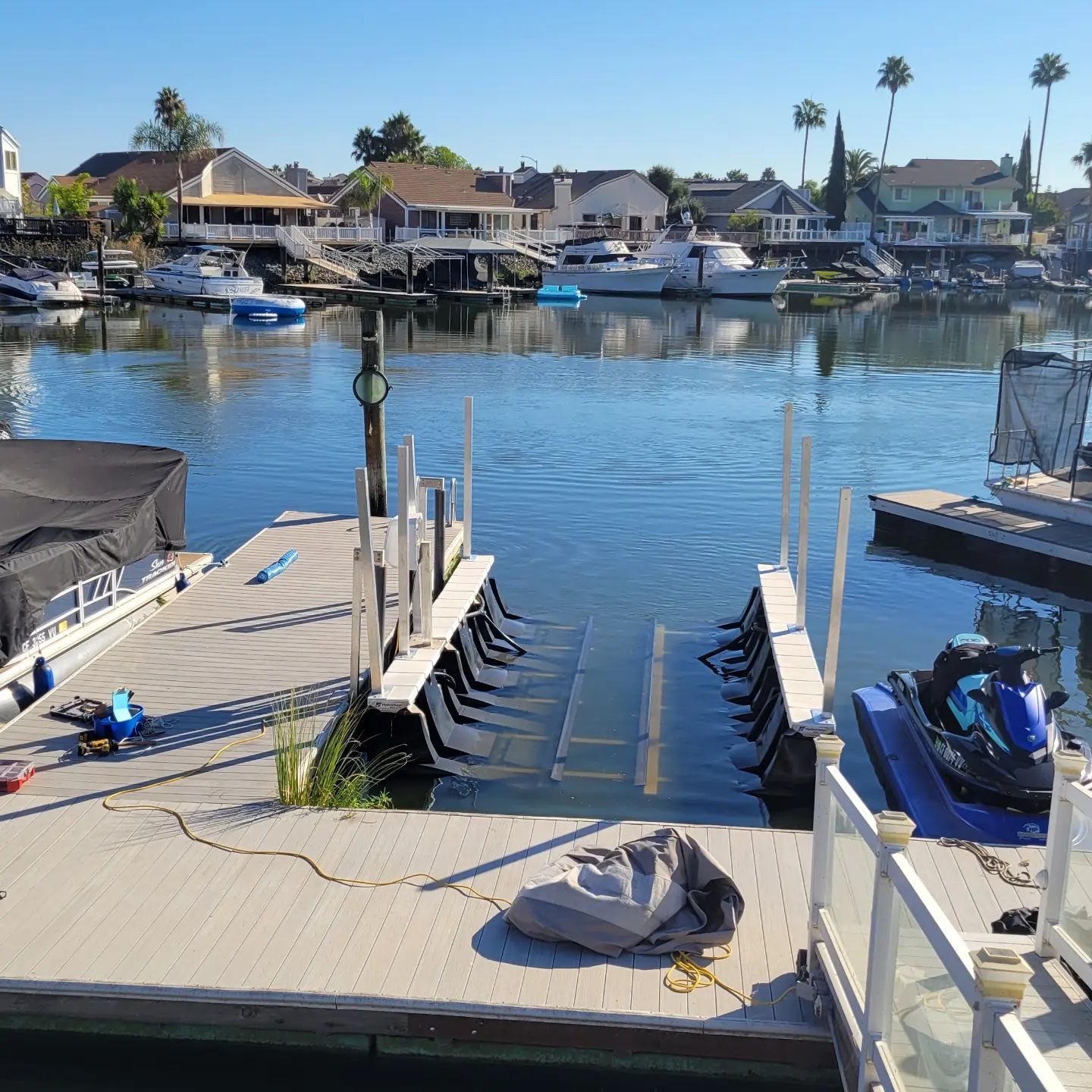 A jet ski is docked at a dock in a harbor