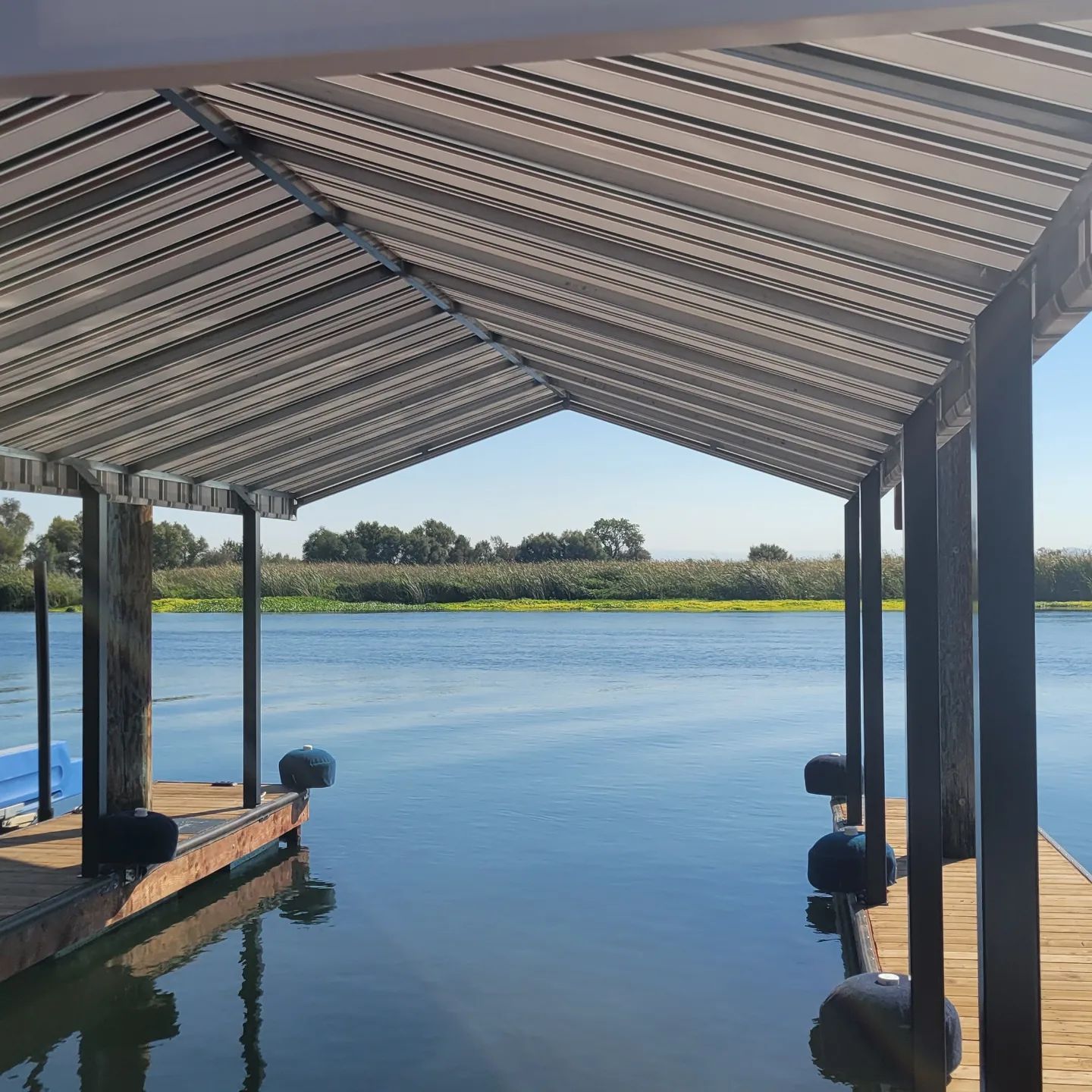 A covered dock overlooking a body of water