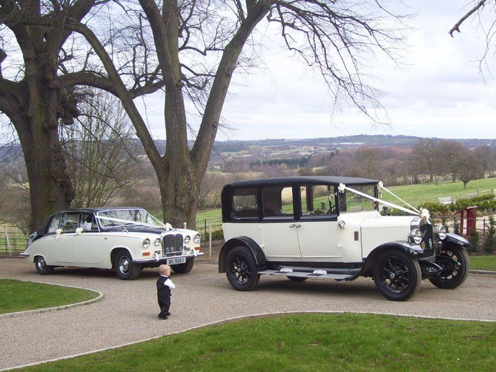 Two vintage wedding cars