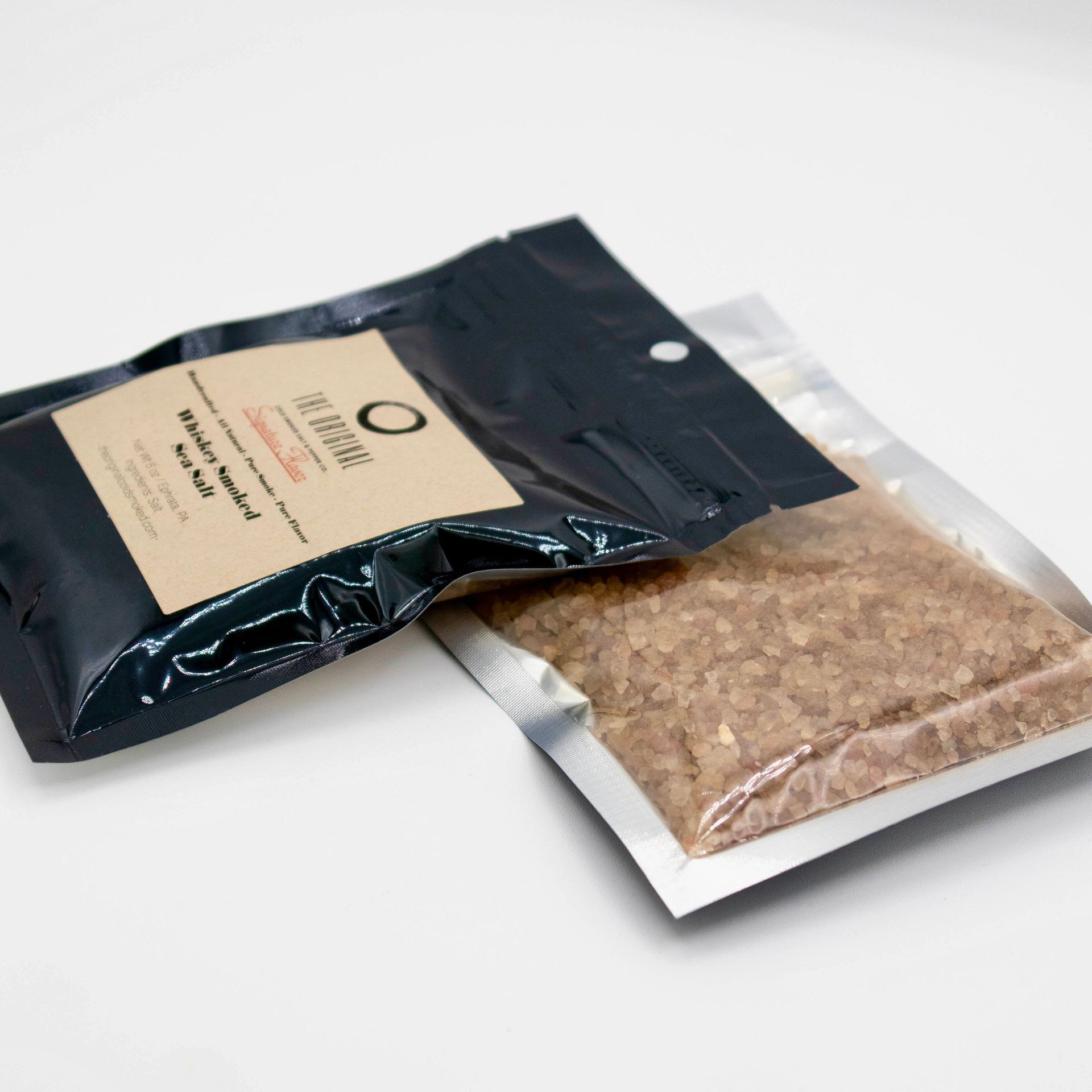 A bag of brown powder with the letter o on it