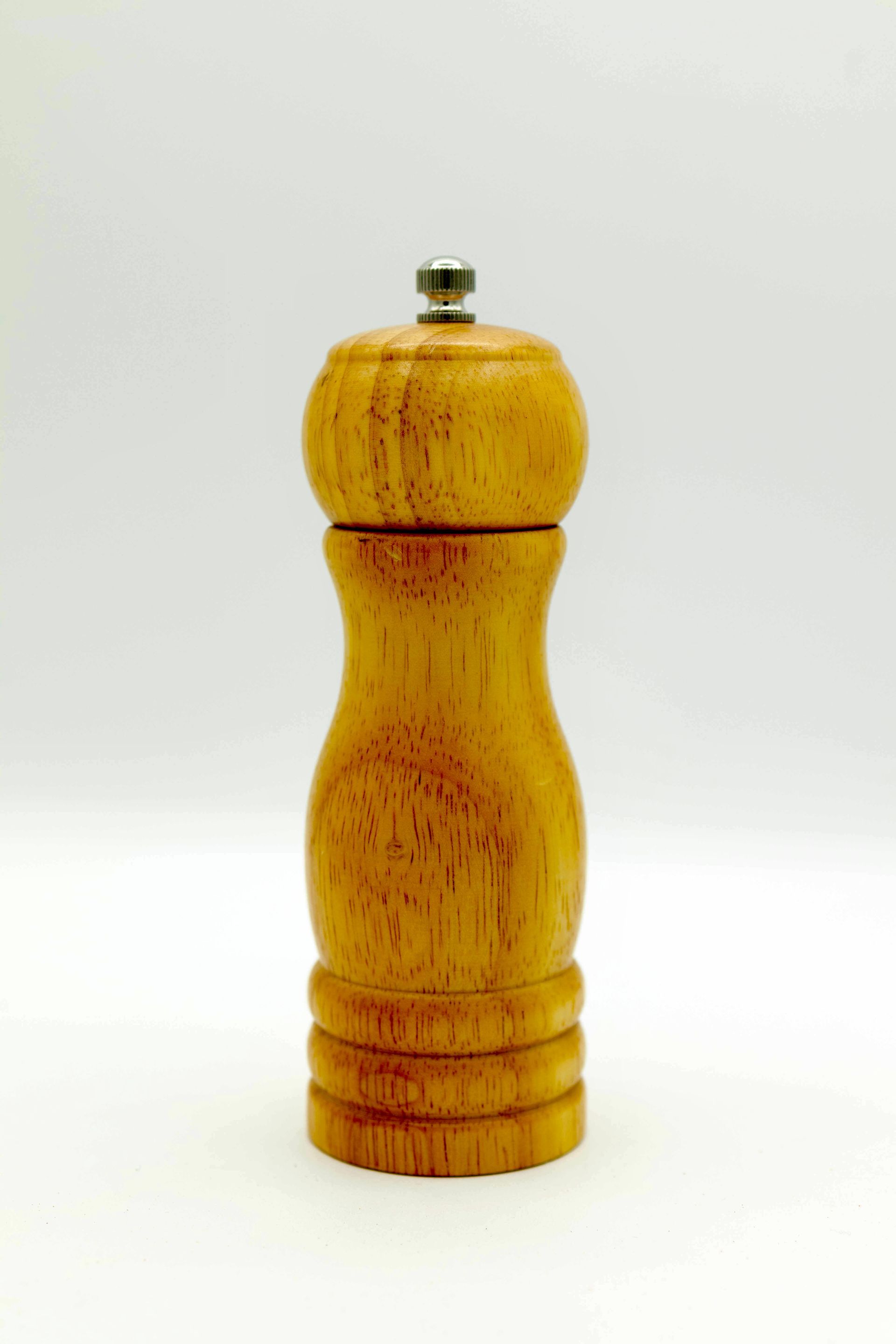 A wooden salt and pepper grinder that says the original on it
