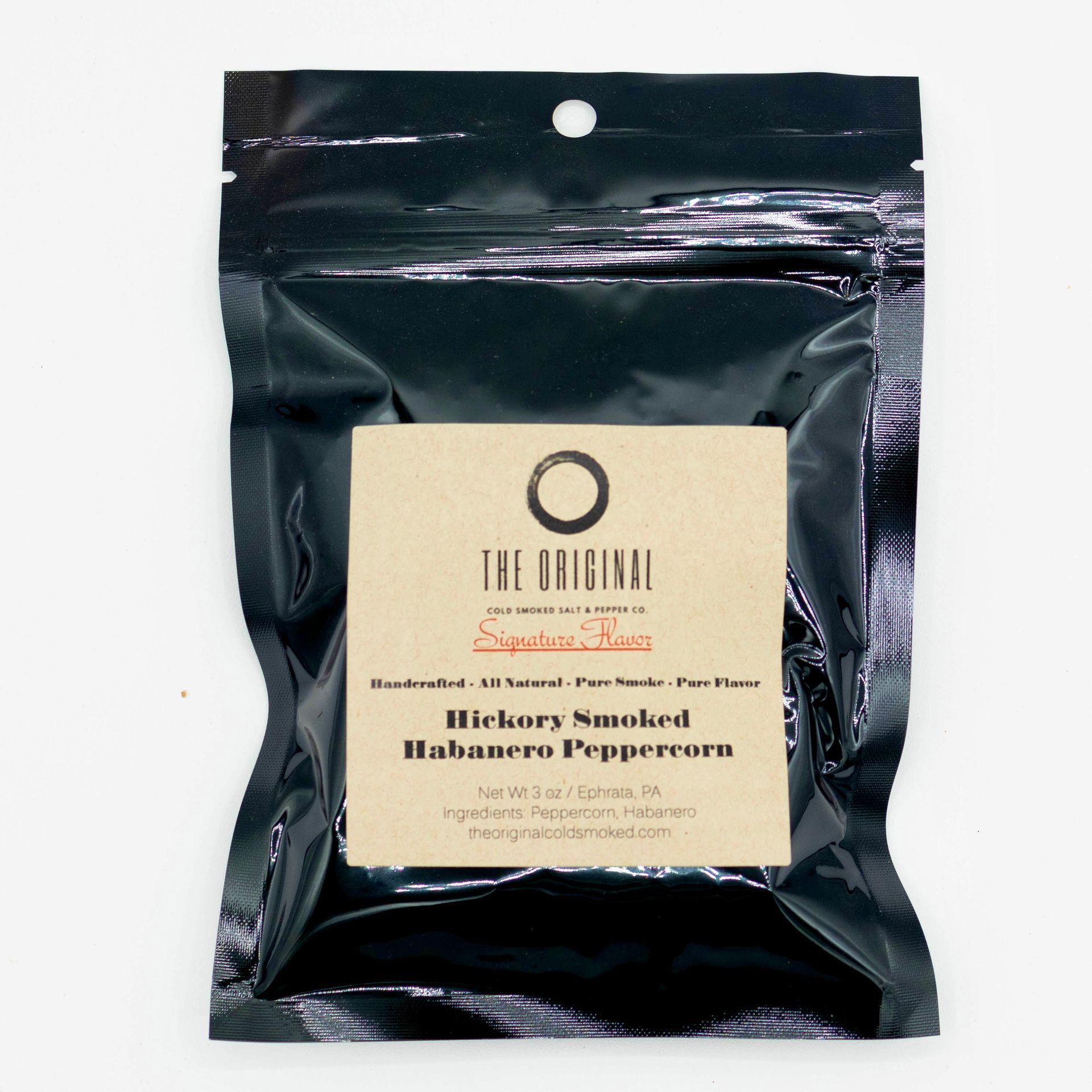 A wooden salt and pepper shaker in a box