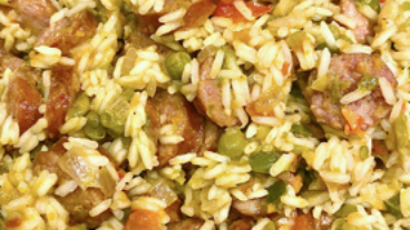picture of rice, sausage, peas, carrots, and peppers