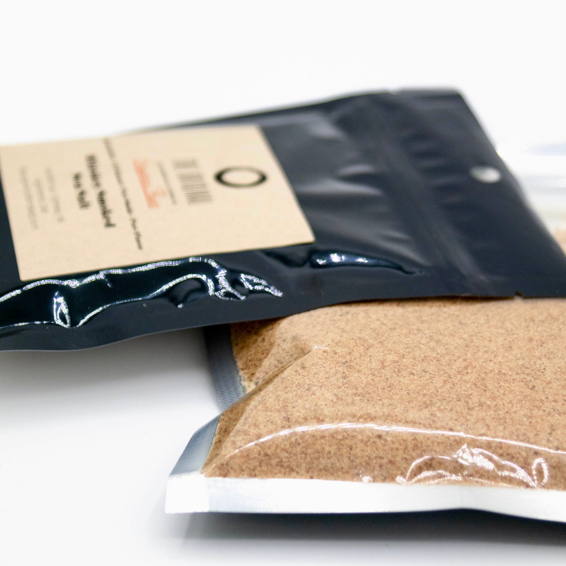 A bag of brown powder with the letter o on it