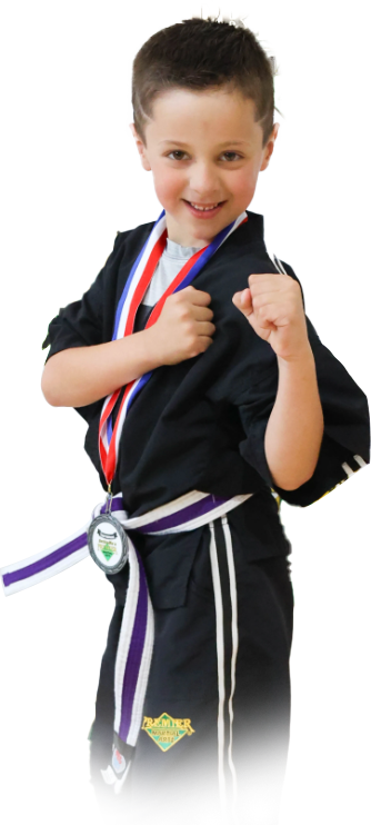 A boy and two girls in karate uniforms are pointing at the camera