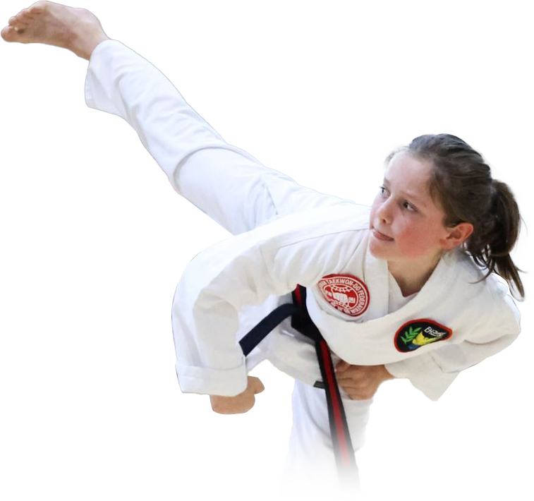 A boy and two girls in karate uniforms are pointing at the camera