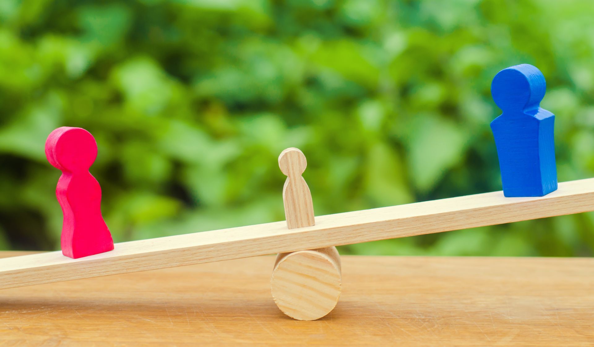 Wooden figures representing the custody of a child. Wooden figures representing the custody of a child.