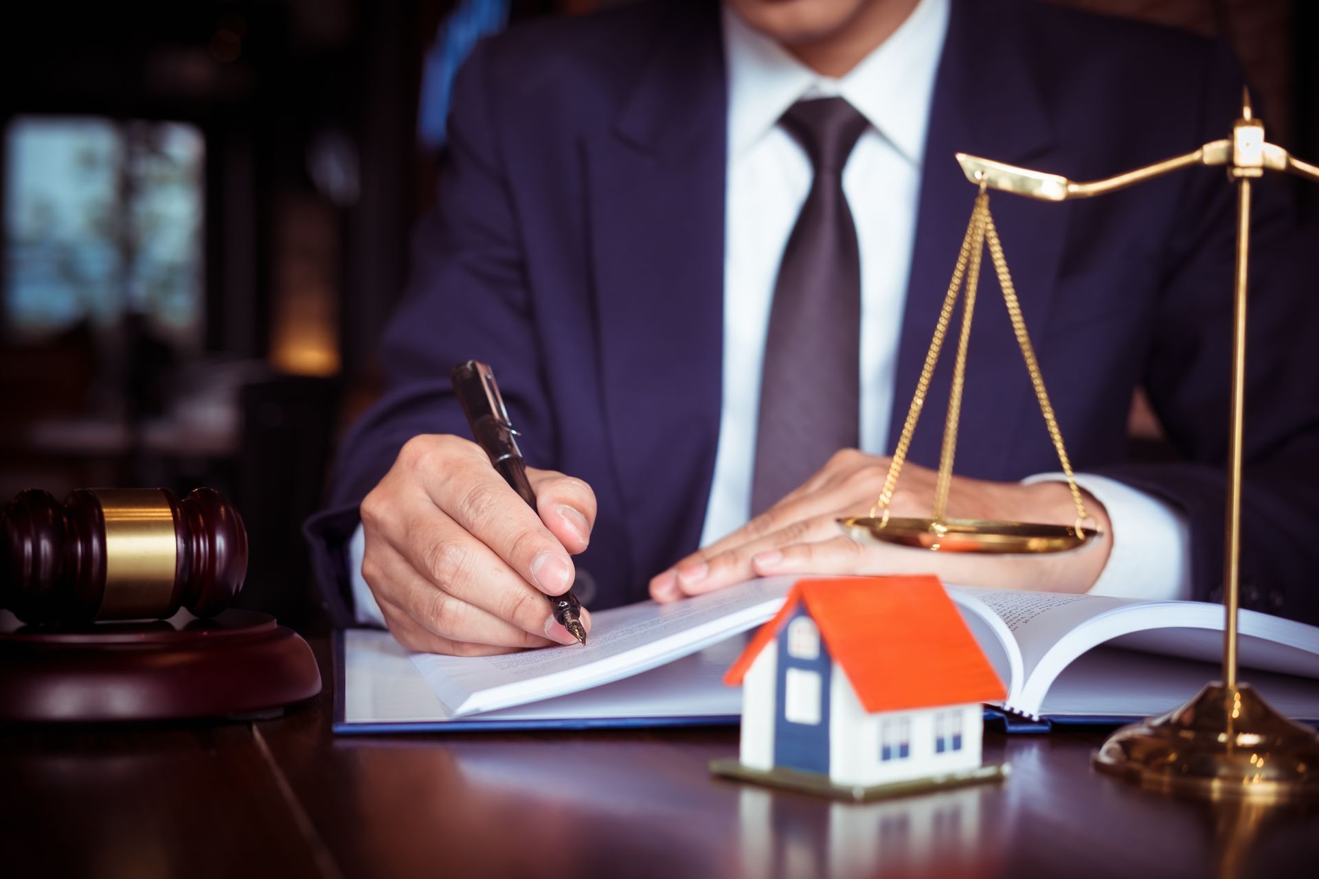 Real Estate Law concept. Gavel on sounding block in hand's Male judge at a courtroom, working for th