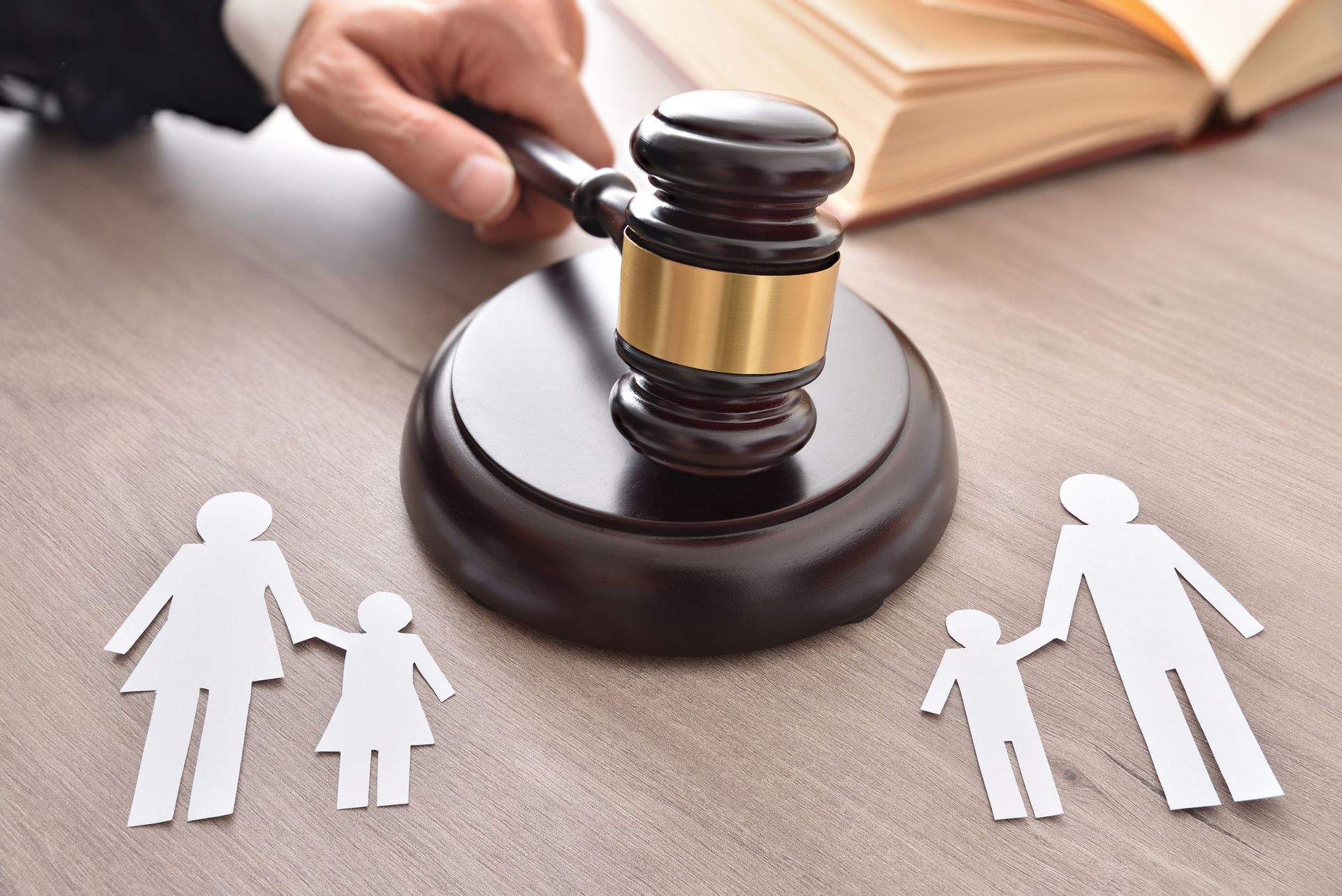 The judge's gavel and paper family are on the table.