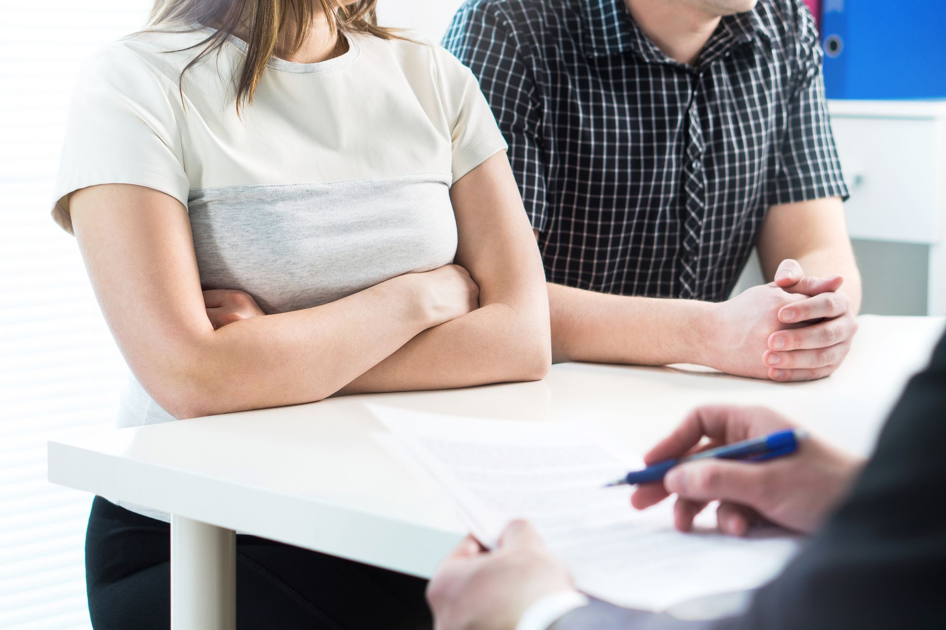 A couple in a meeting with a child custody lawyer. A couple in a meeting with a child custody lawyer.
