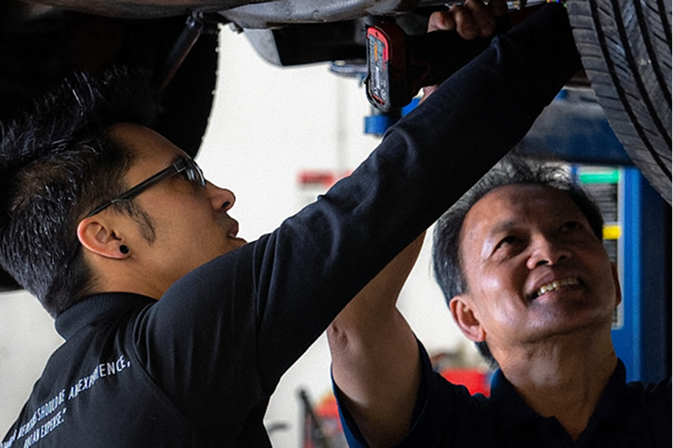 mechanic working underneath car | Oscar's Automotive