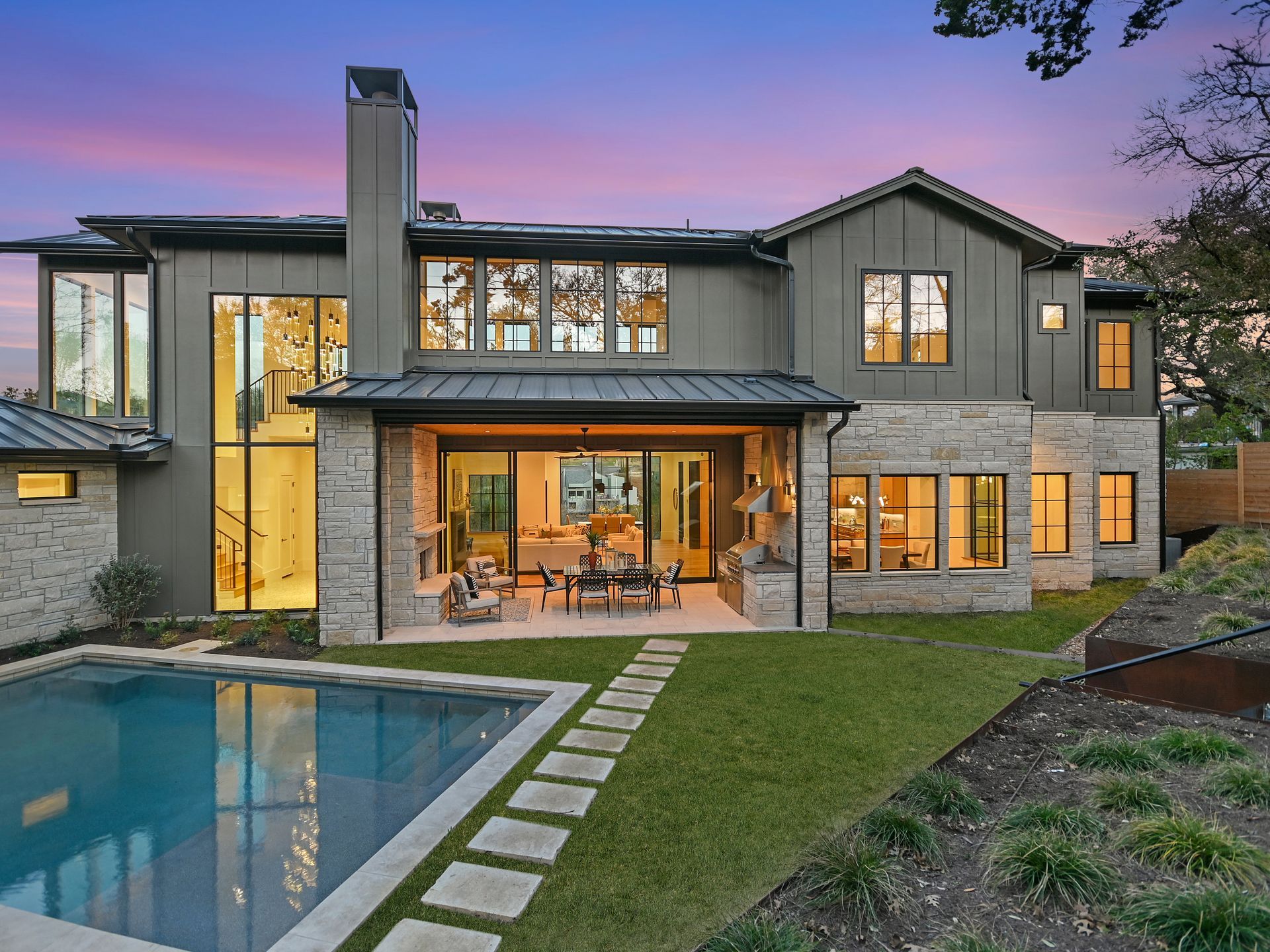 A large house with a swimming pool in the backyard