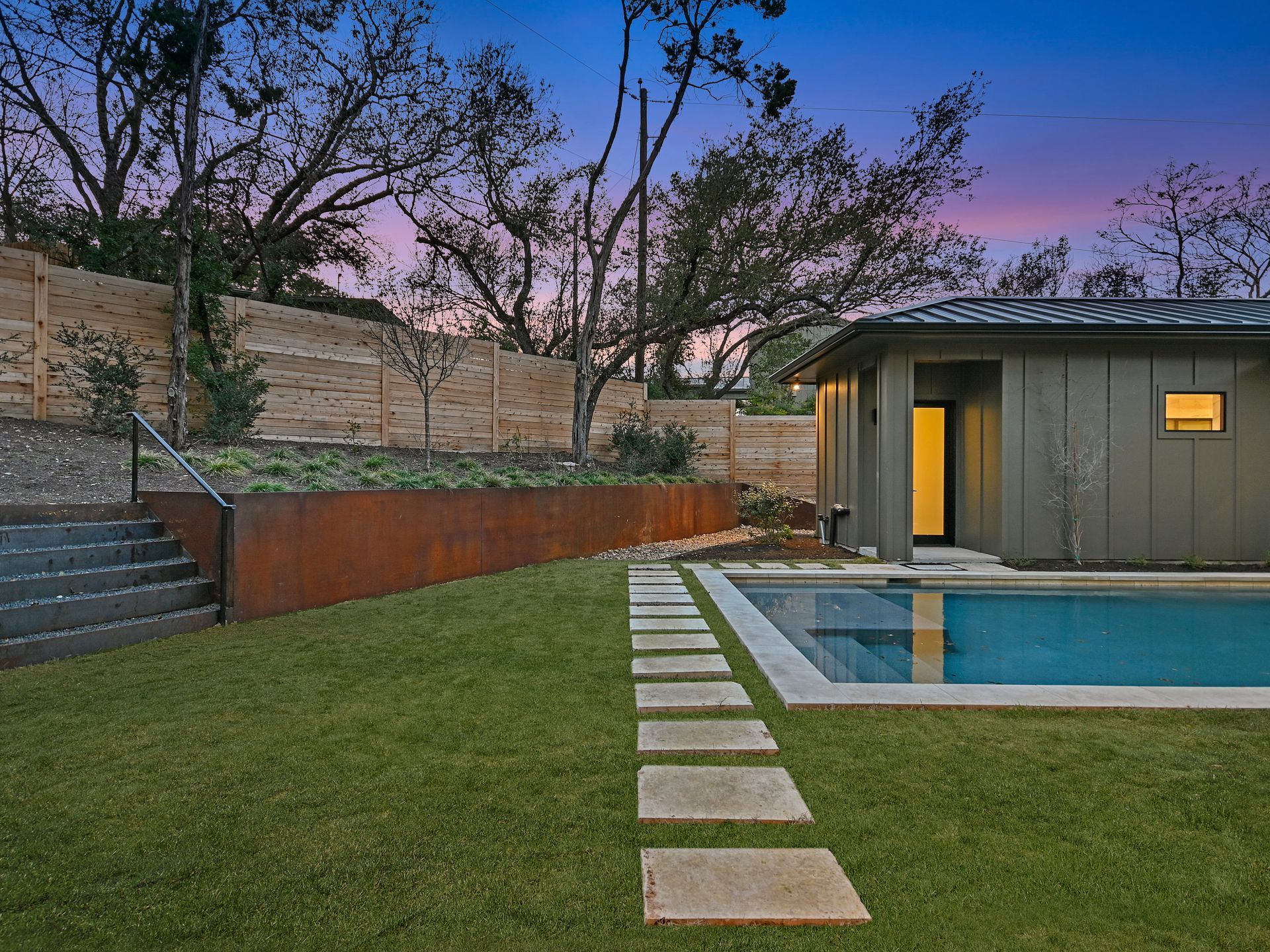A house with a swimming pool in the backyard