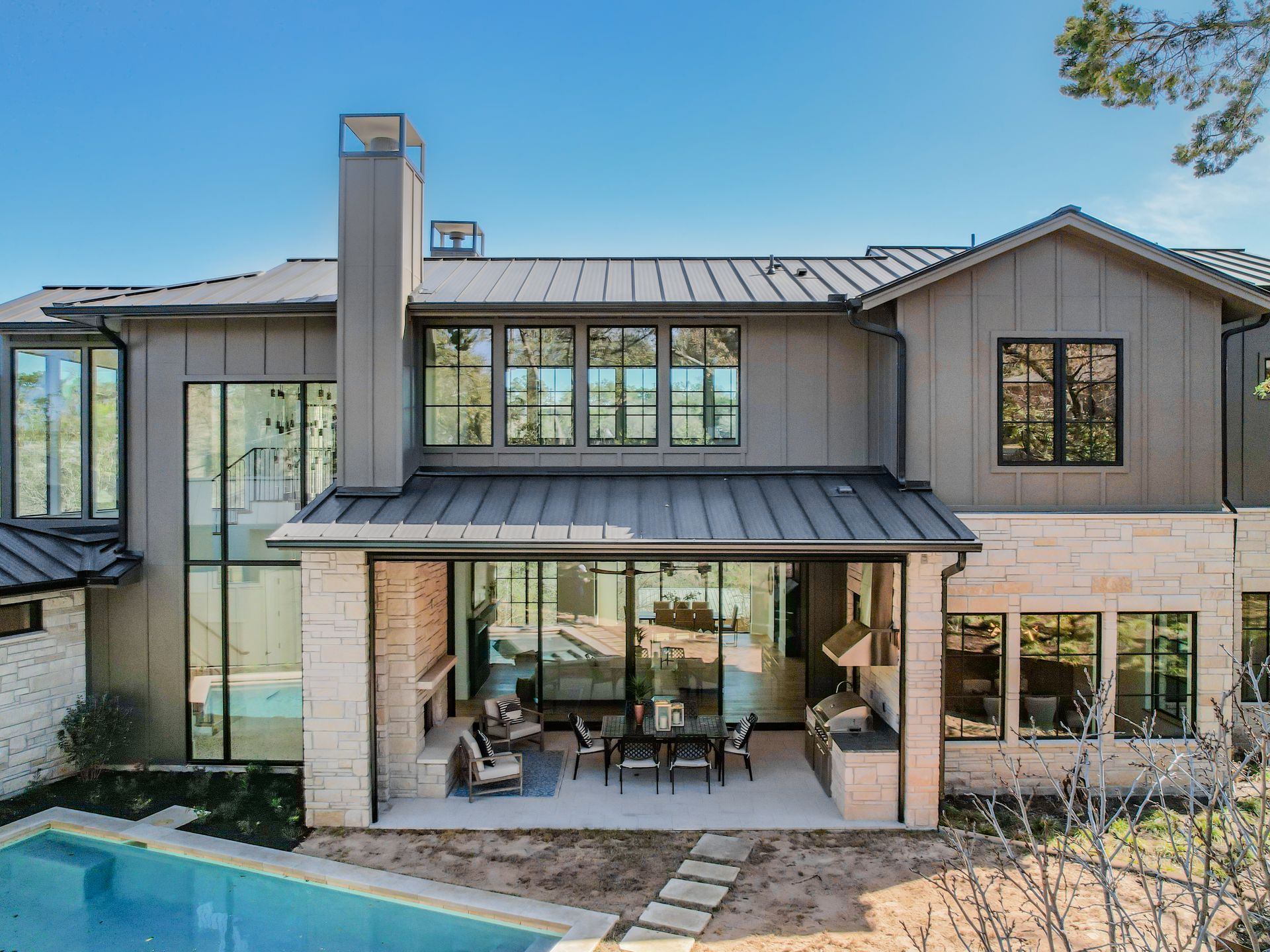 A large house with a swimming pool in the backyard