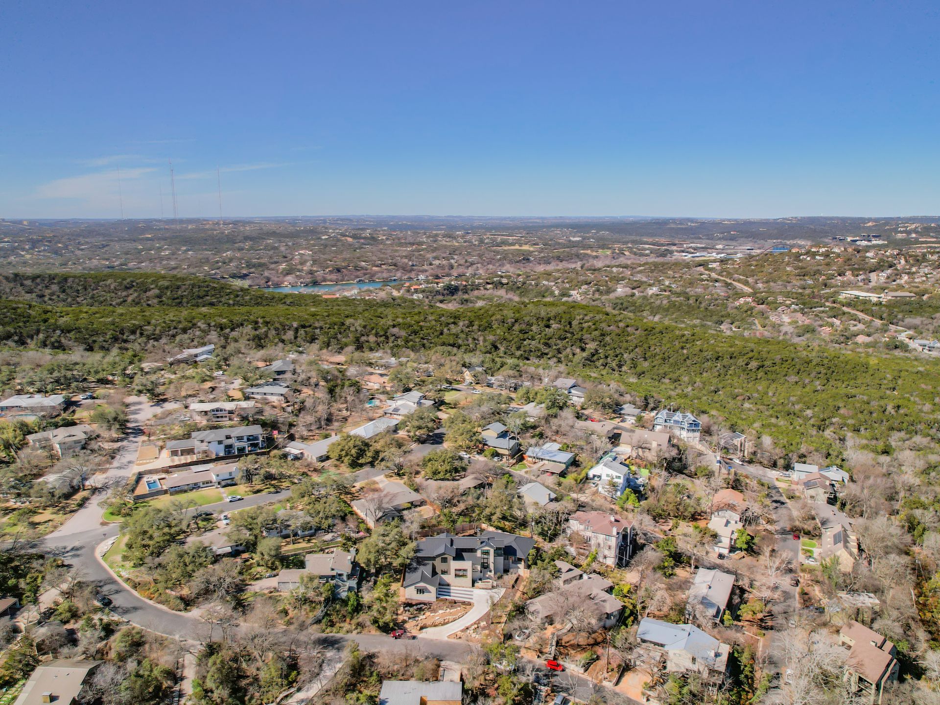 An aerial view of a residential area with lots of houses and trees.