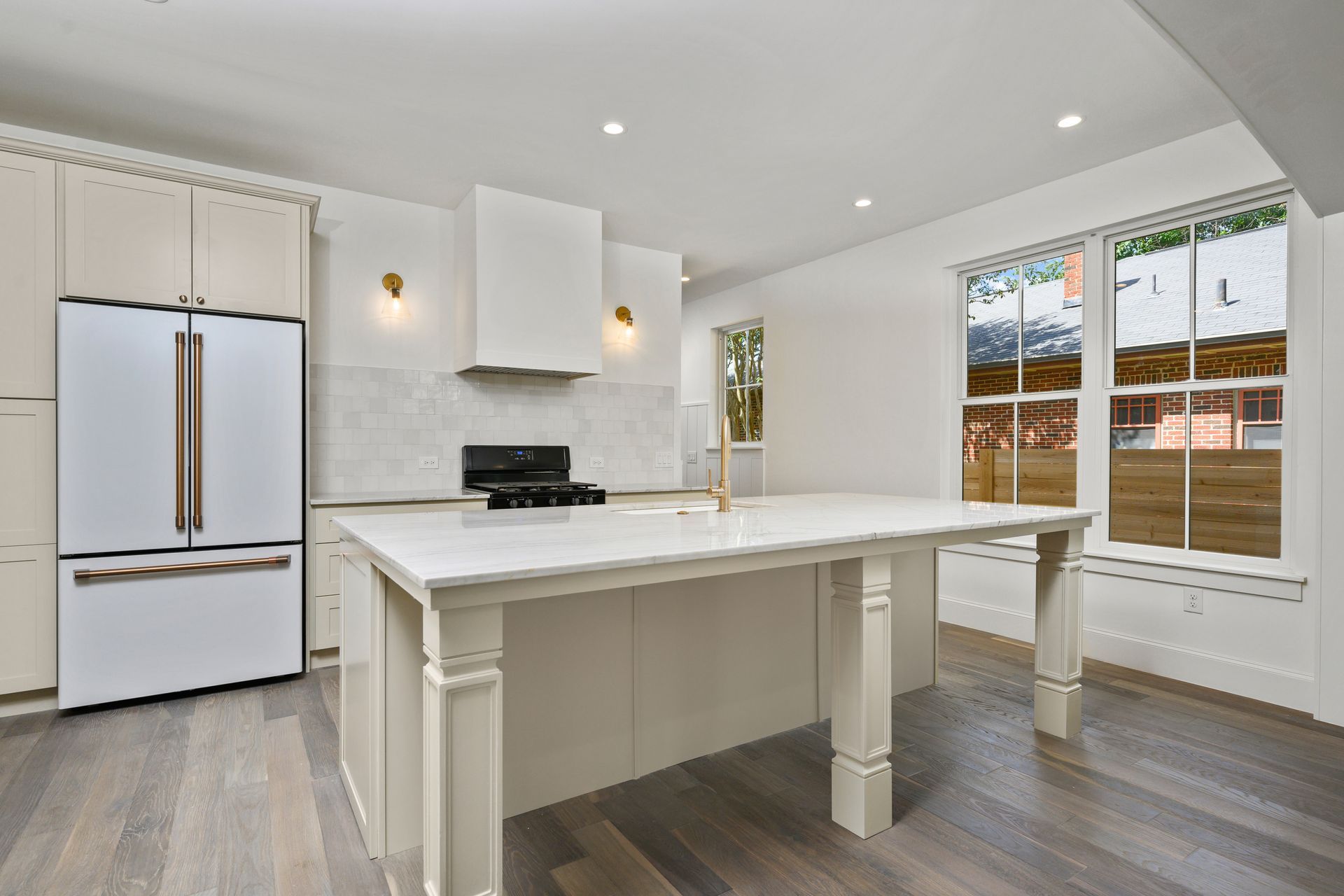 There is a large island in the middle of the kitchen.