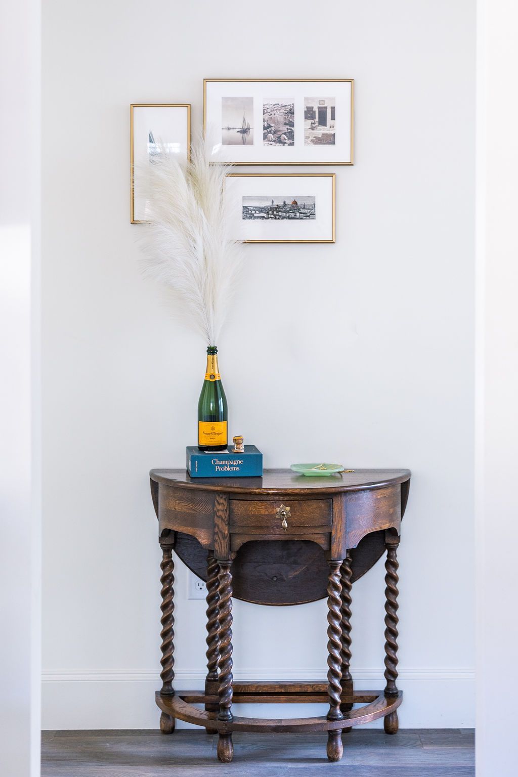 A wooden table with a bottle of champagne on it.