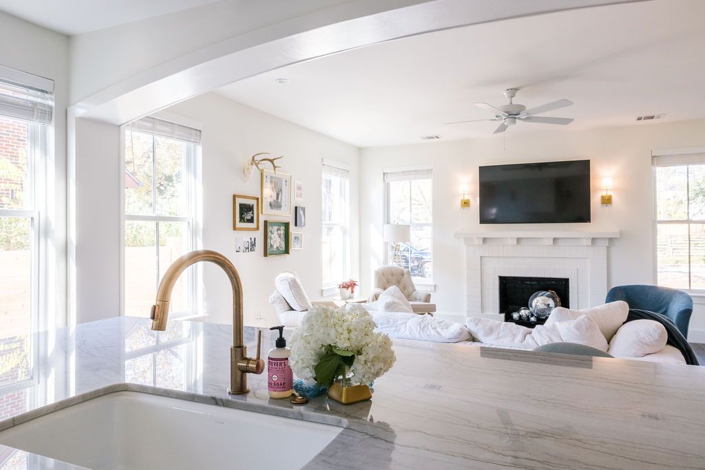 A kitchen sink is sitting in the middle of a living room.