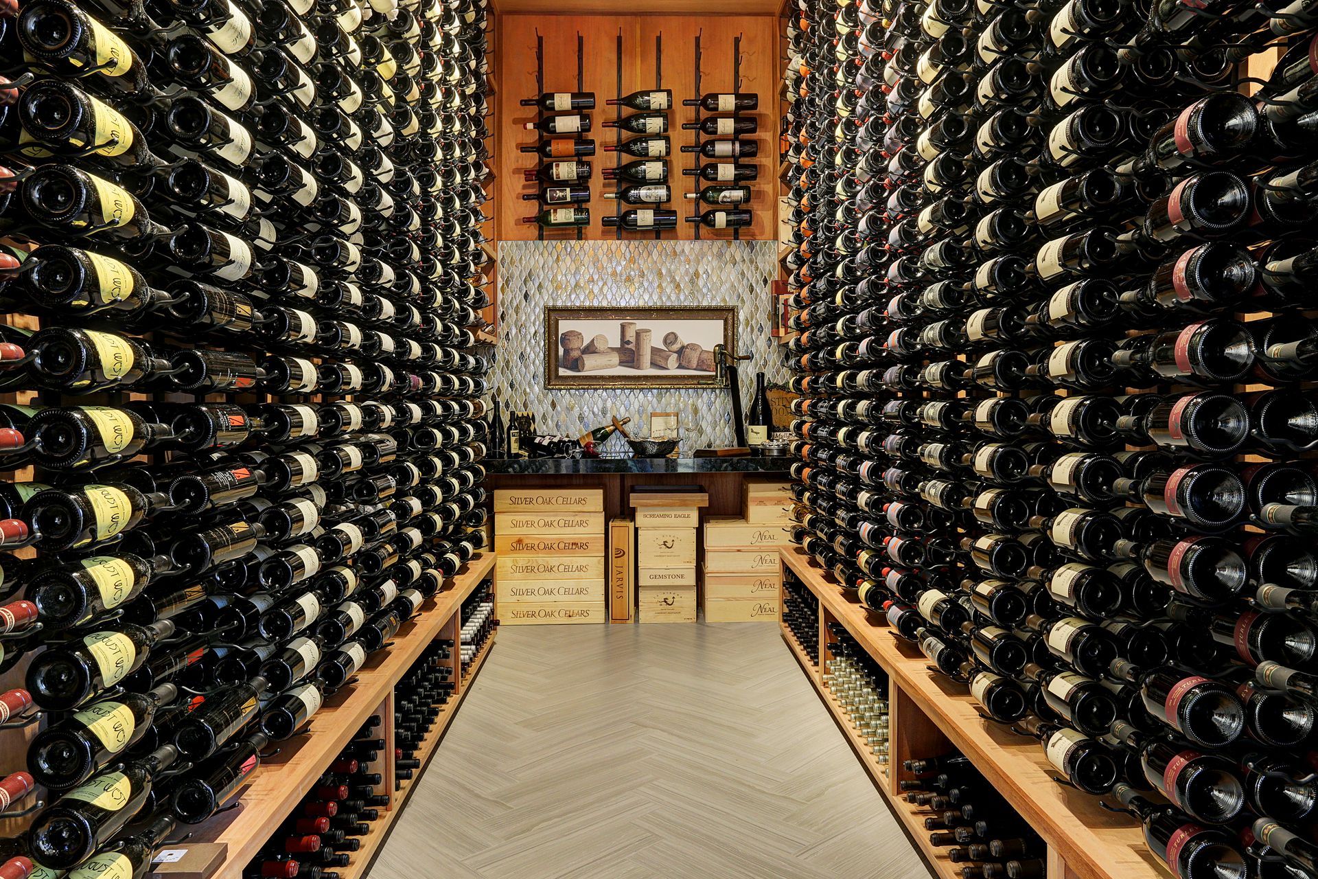 Wine cellar filled with rows of bottled wine; wooden racks, bottles horizontal.