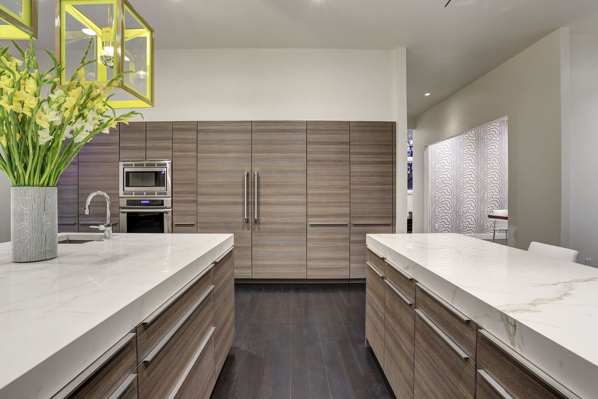 A kitchen with wooden cabinets and white counter tops