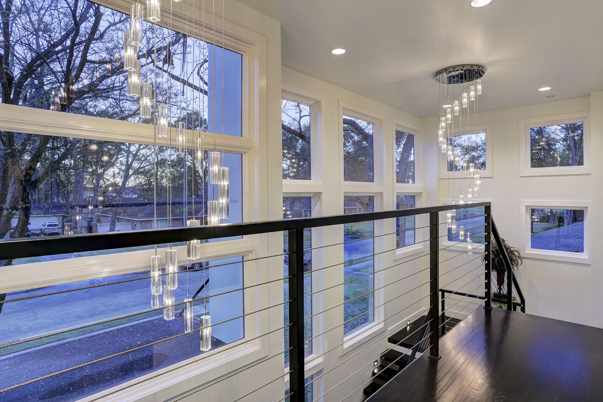 A room with a lot of windows and a staircase