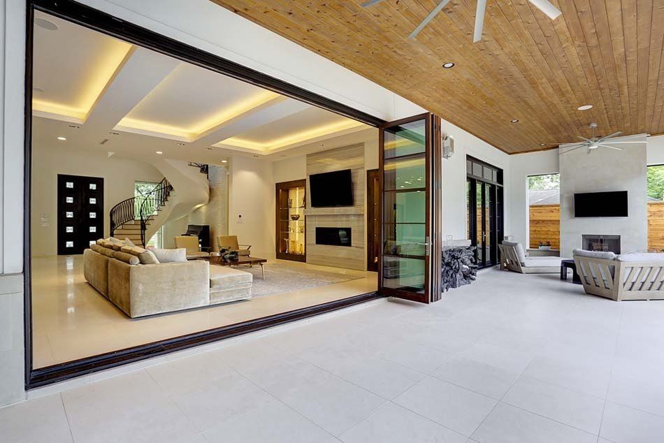 A living room with a sliding glass door leading to a patio.
