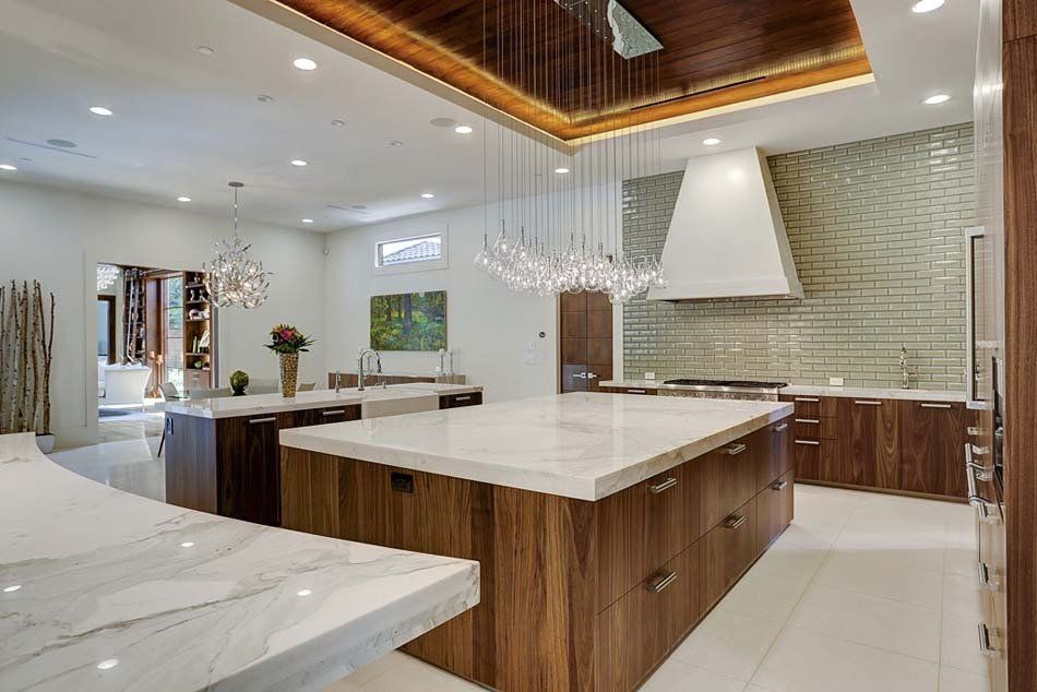 There is a large island in the middle of the kitchen.