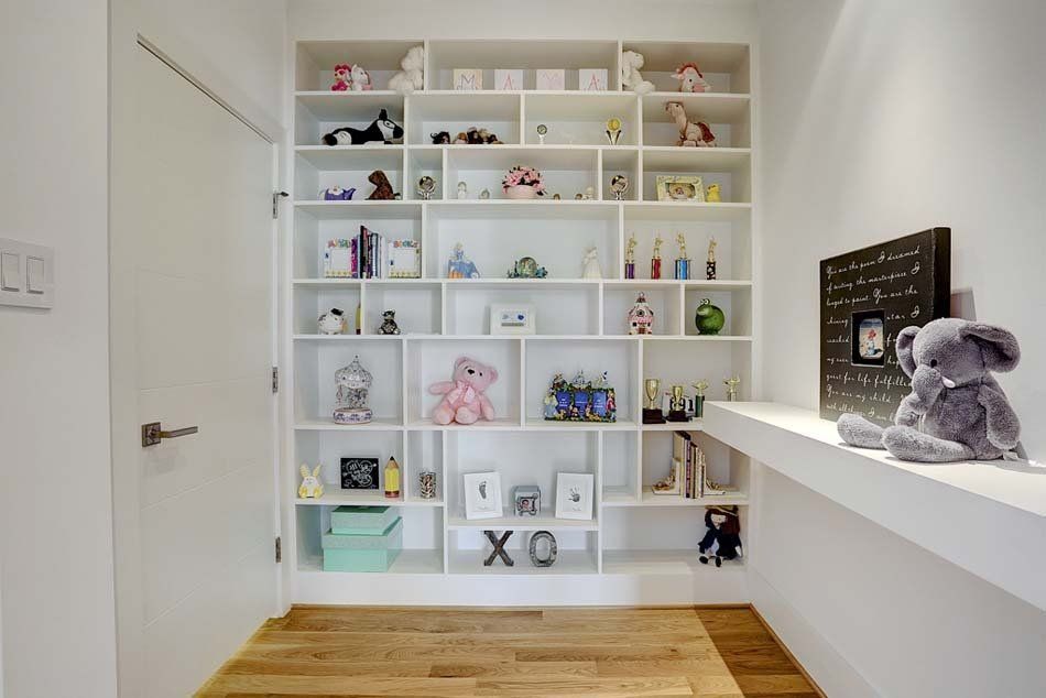A room with a lot of shelves and toys on them