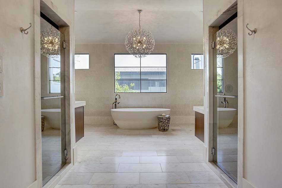 There is a bathtub in the middle of the bathroom.