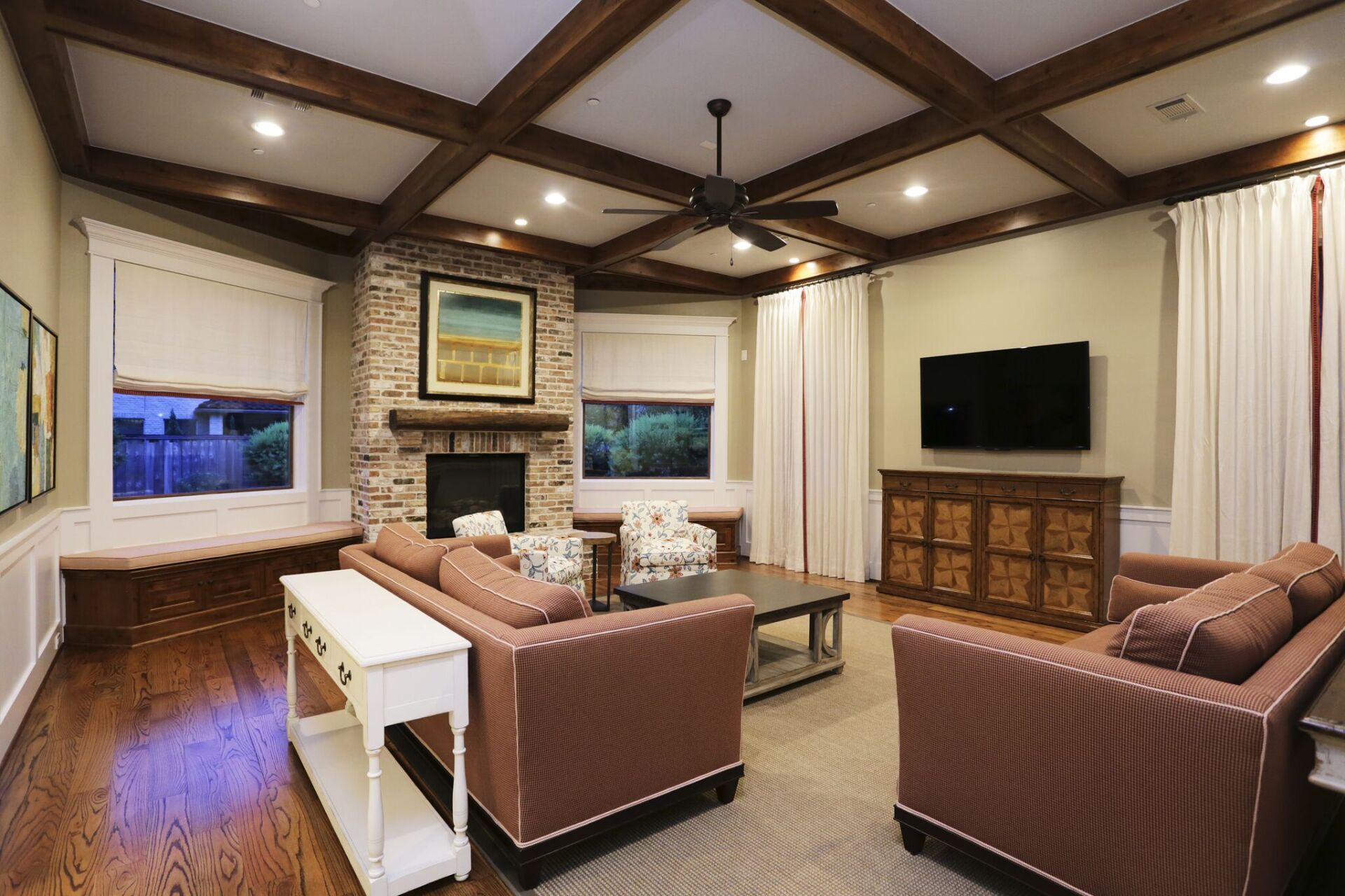 There is a fireplace in the middle of the living room.