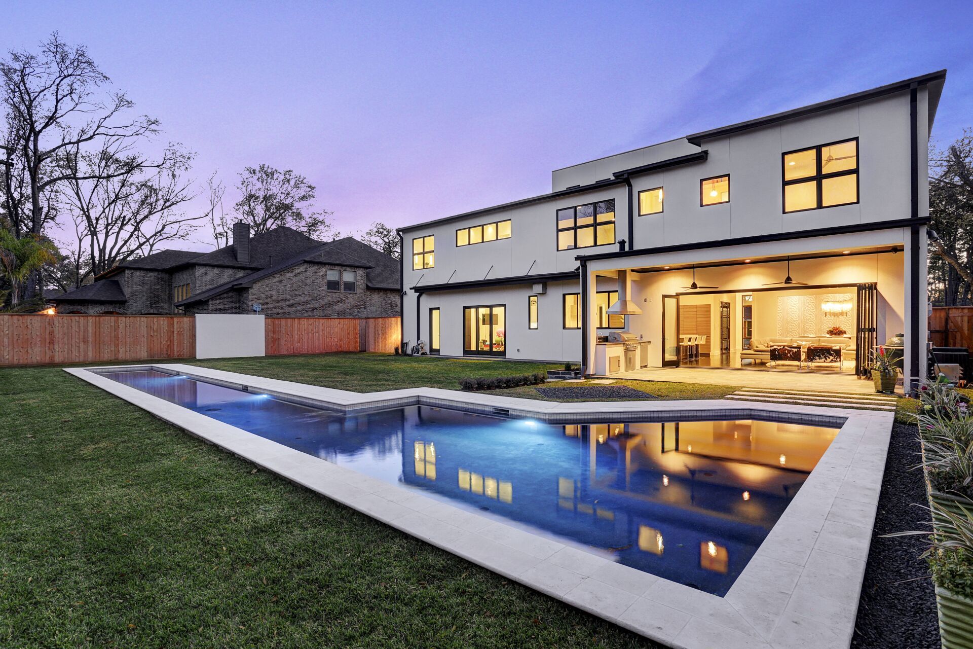 A large house with a large swimming pool in the backyard