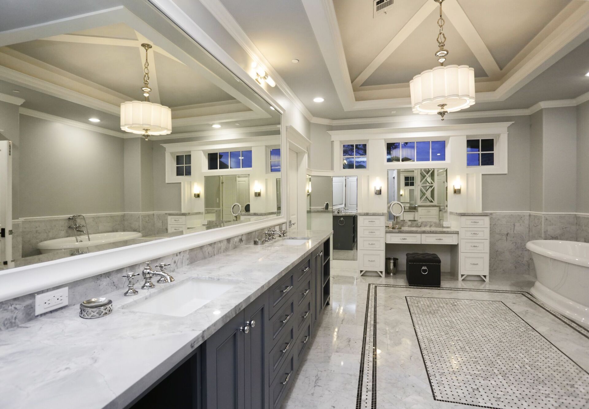 A bathroom with two sinks and a bathtub