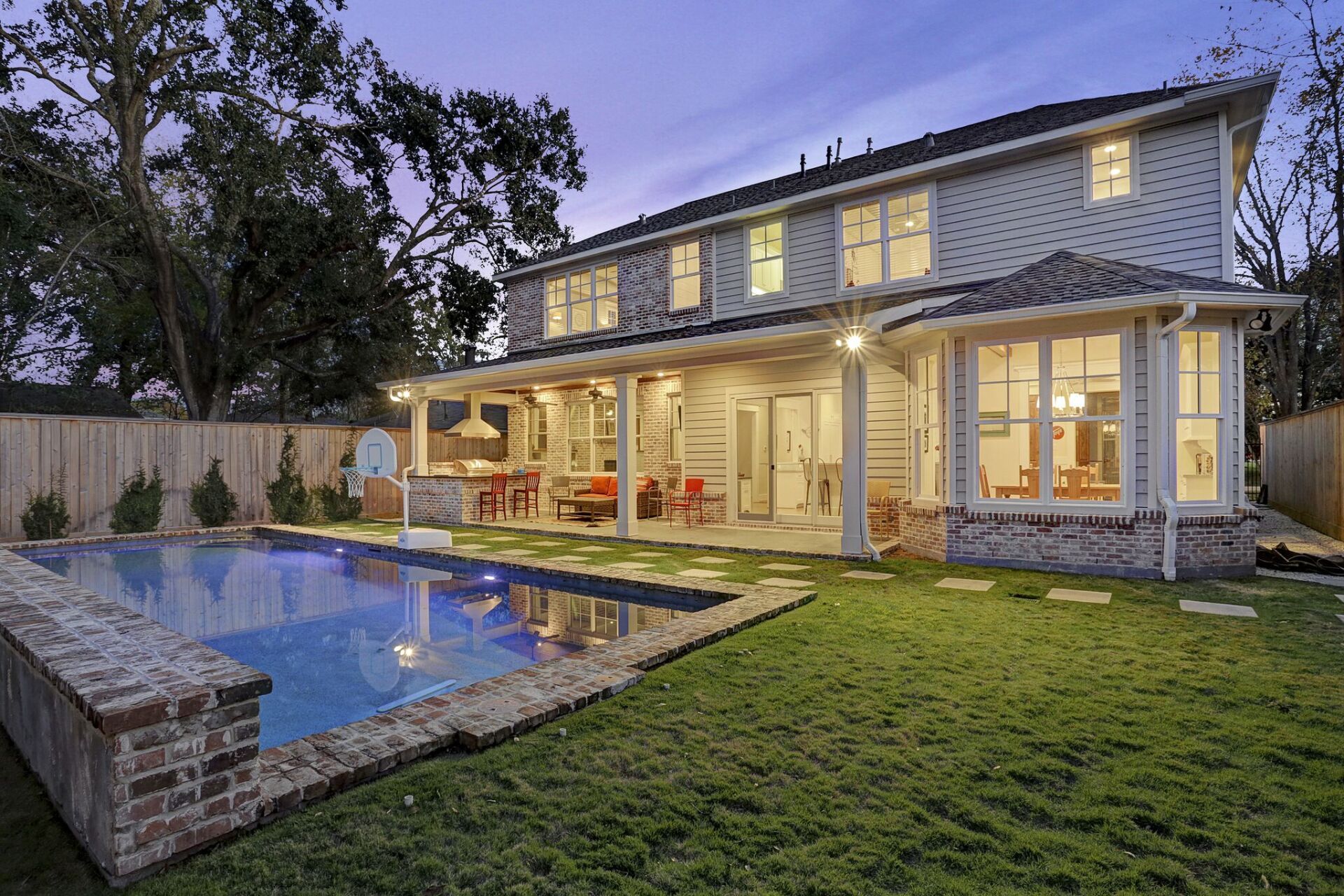 A large house with a swimming pool in the backyard