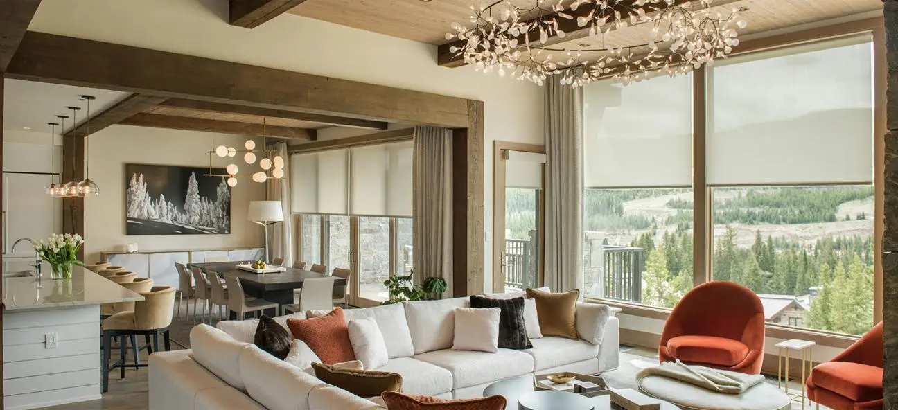 Stalks with icy droplets in shallow, reflective water. Overcast day with muted blue and brown tones.