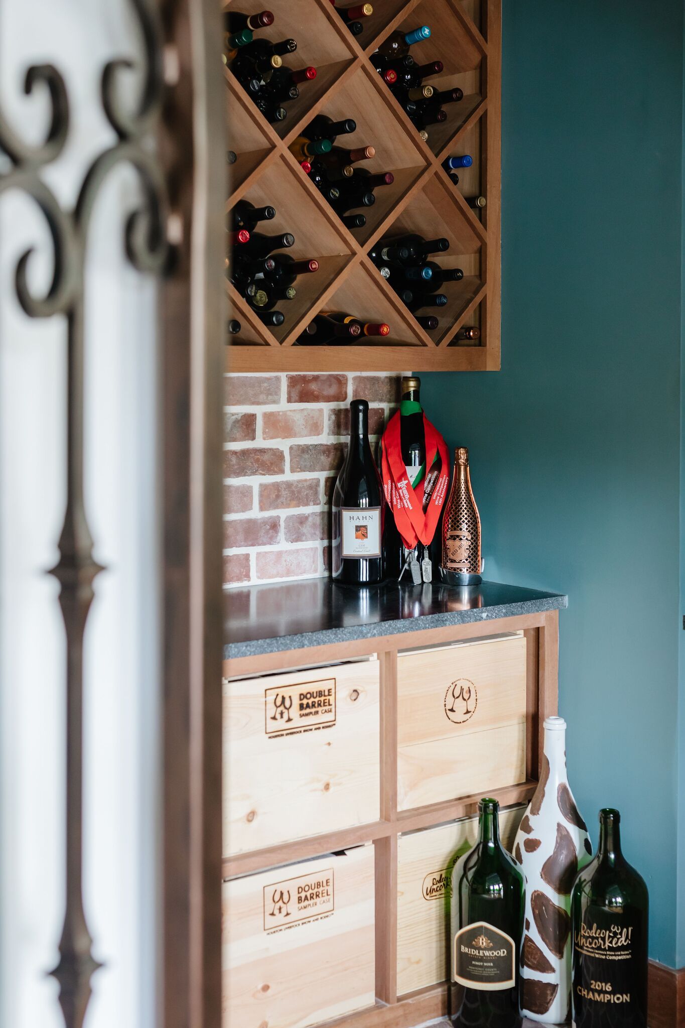 A wine rack with bottles of wine on it in a room.