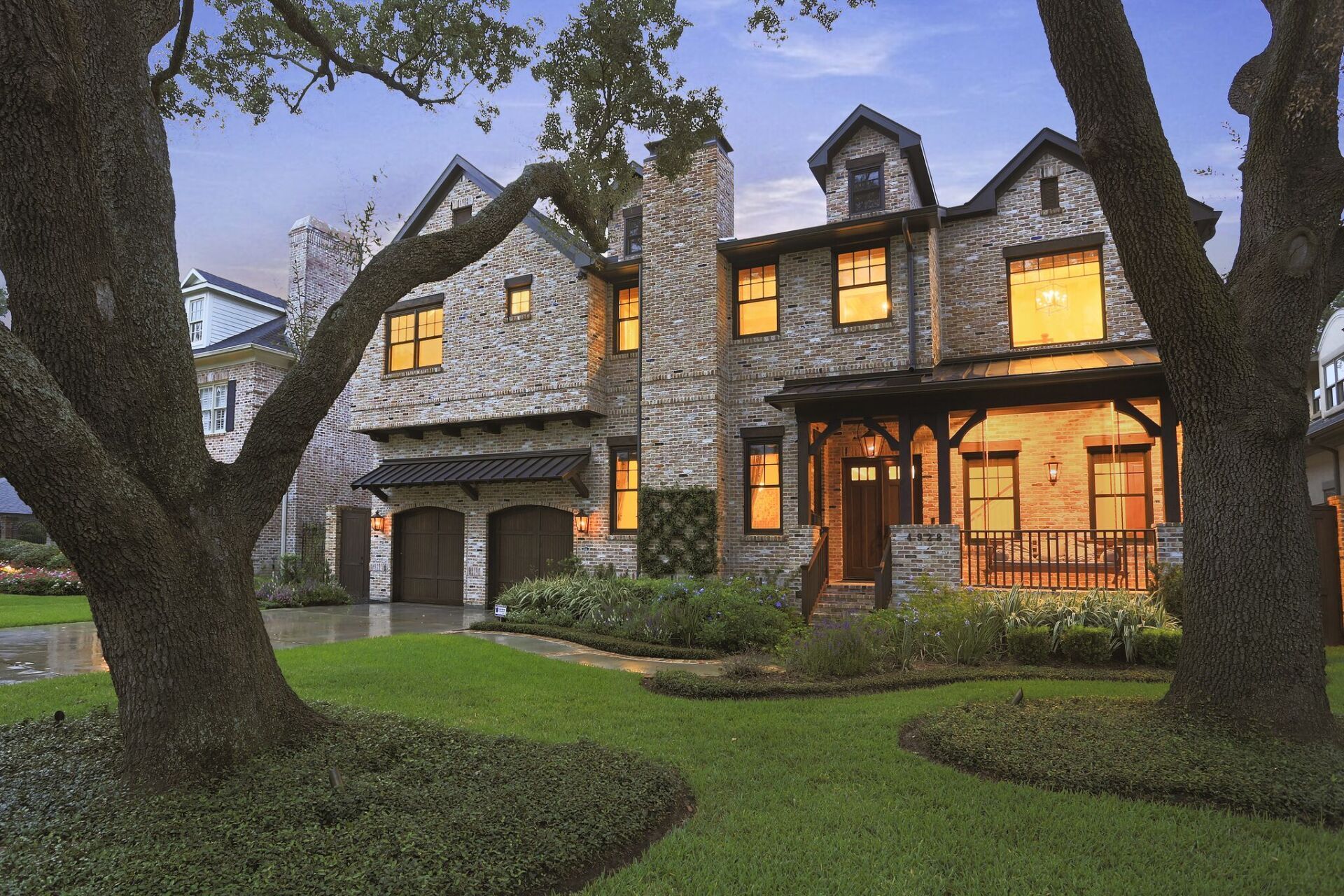 A large house with a large tree in front of it