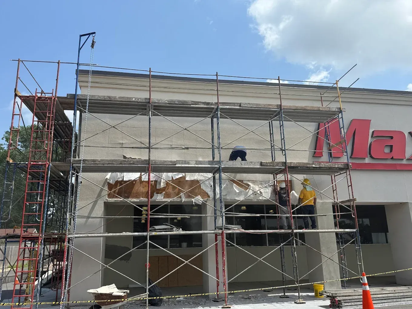 Scaffolding surrounds a building with the