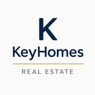 KeyHomes Real Estate logo: dark blue "K" above "KeyHomes" and "REAL ESTATE", all on white. Gold line separates.
