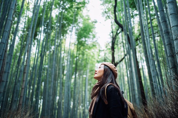 Happy woman surrounded by bamboos | Cleveland, OH | Healthy Solutions Inc