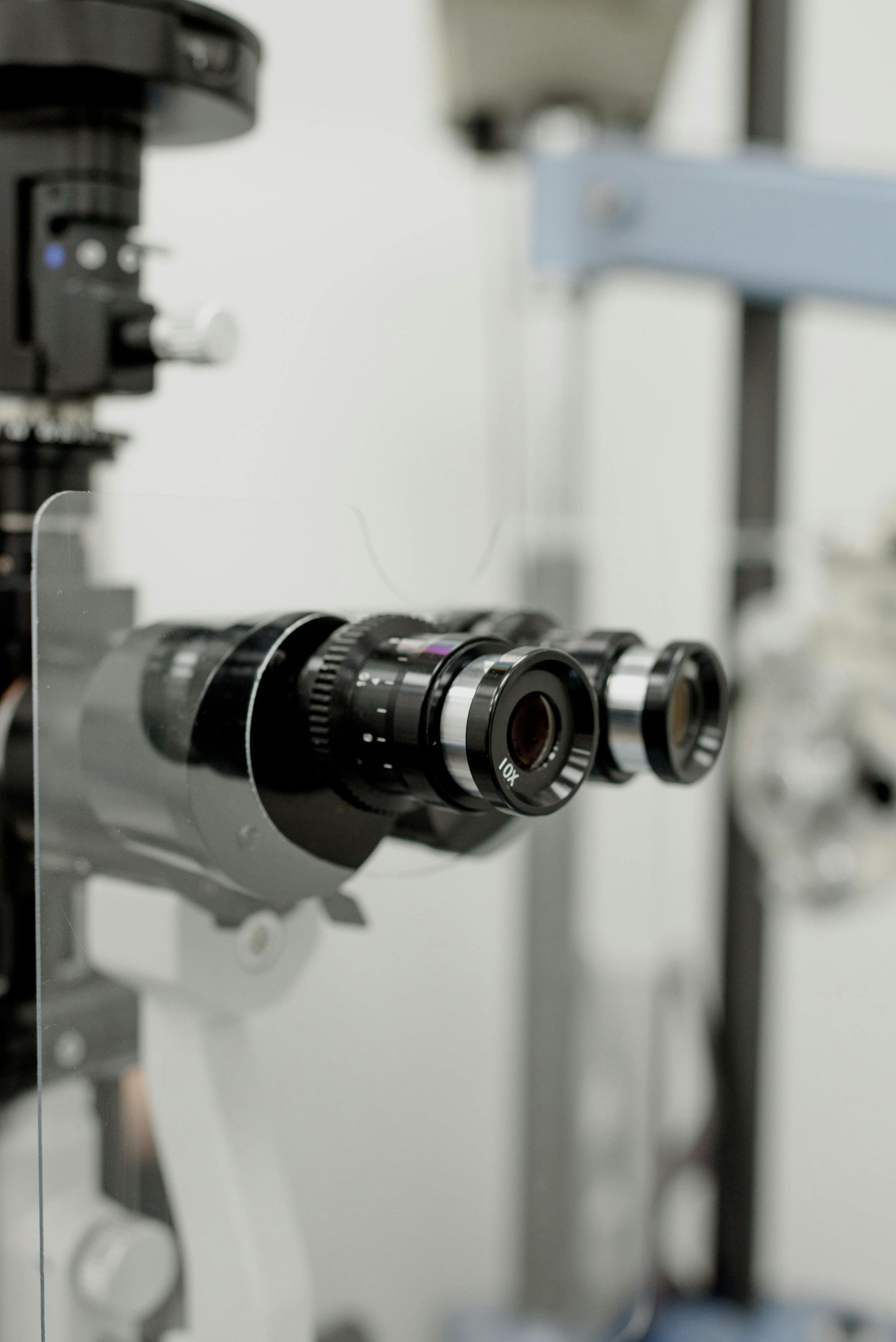 A close up of a microscope in a laboratory.