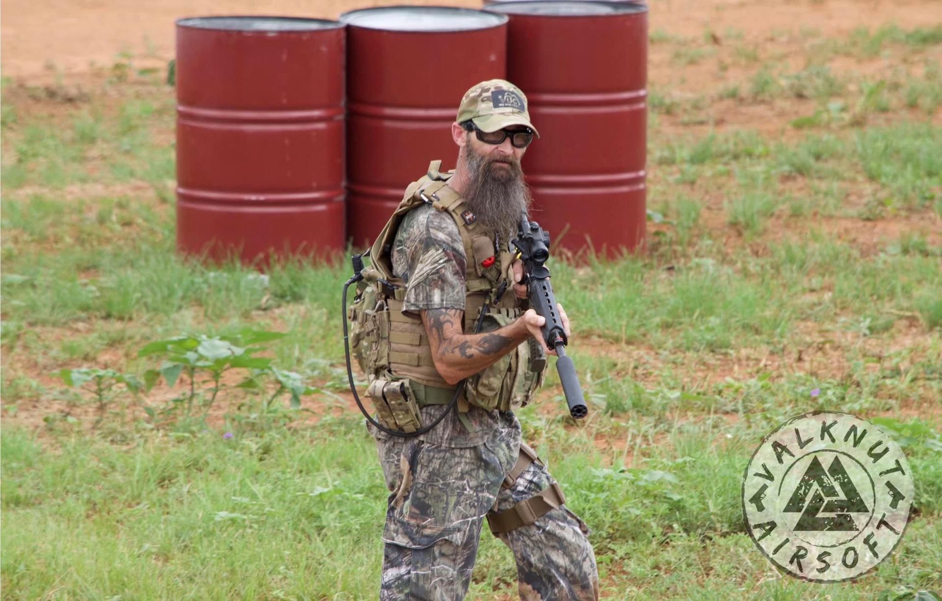 A man holding an airsoft rifle