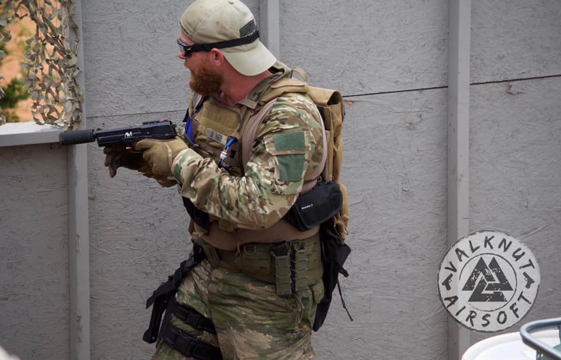 Airsoft player looking at the window