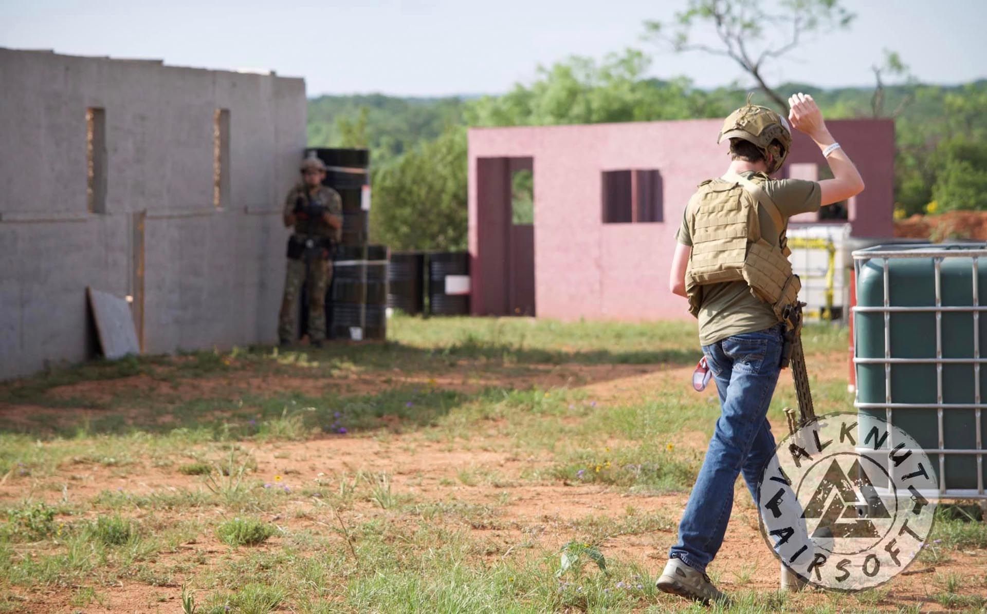 A man surrendering in an airsoft game