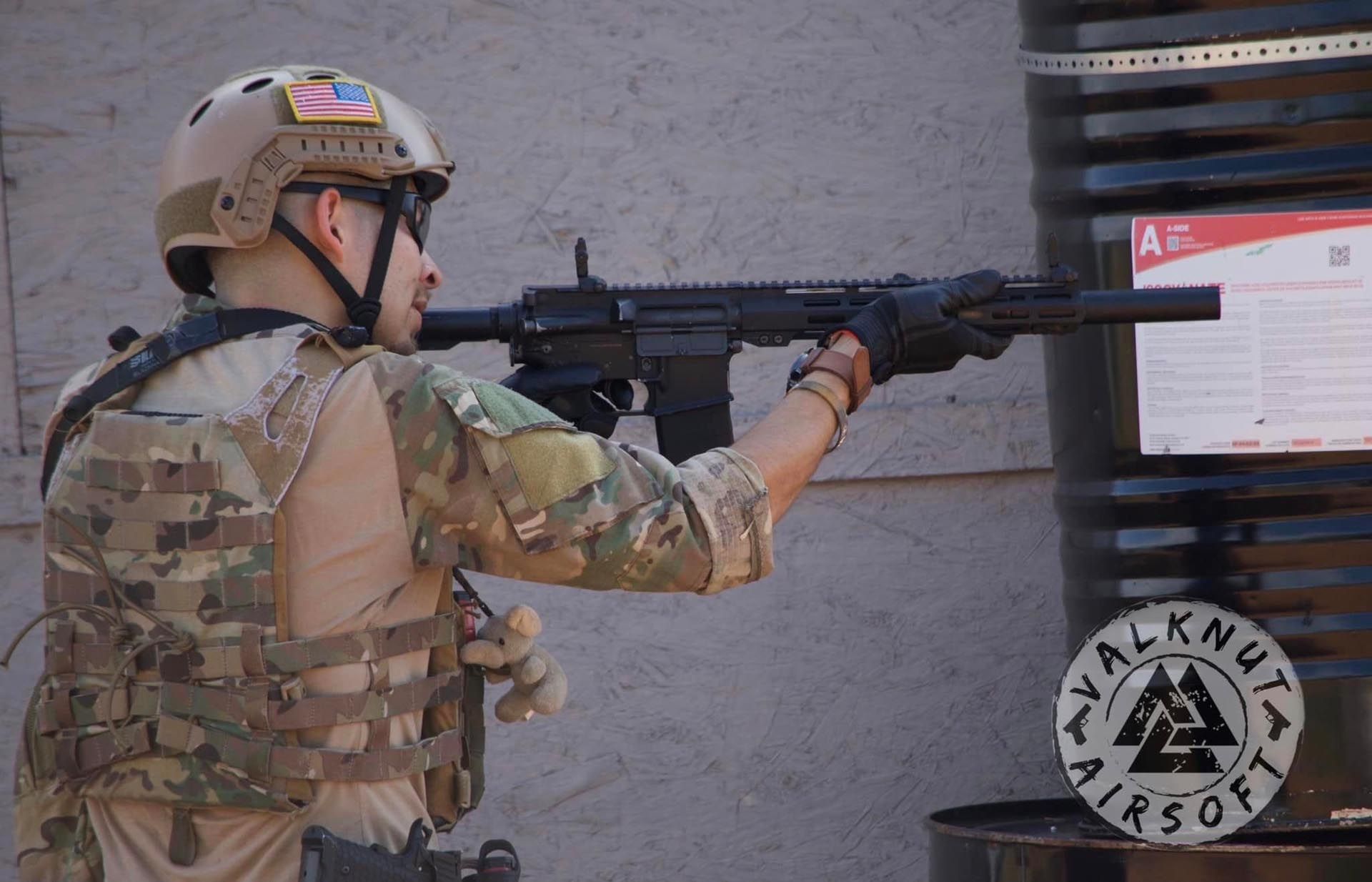 A man holding an airsoft rifle gun