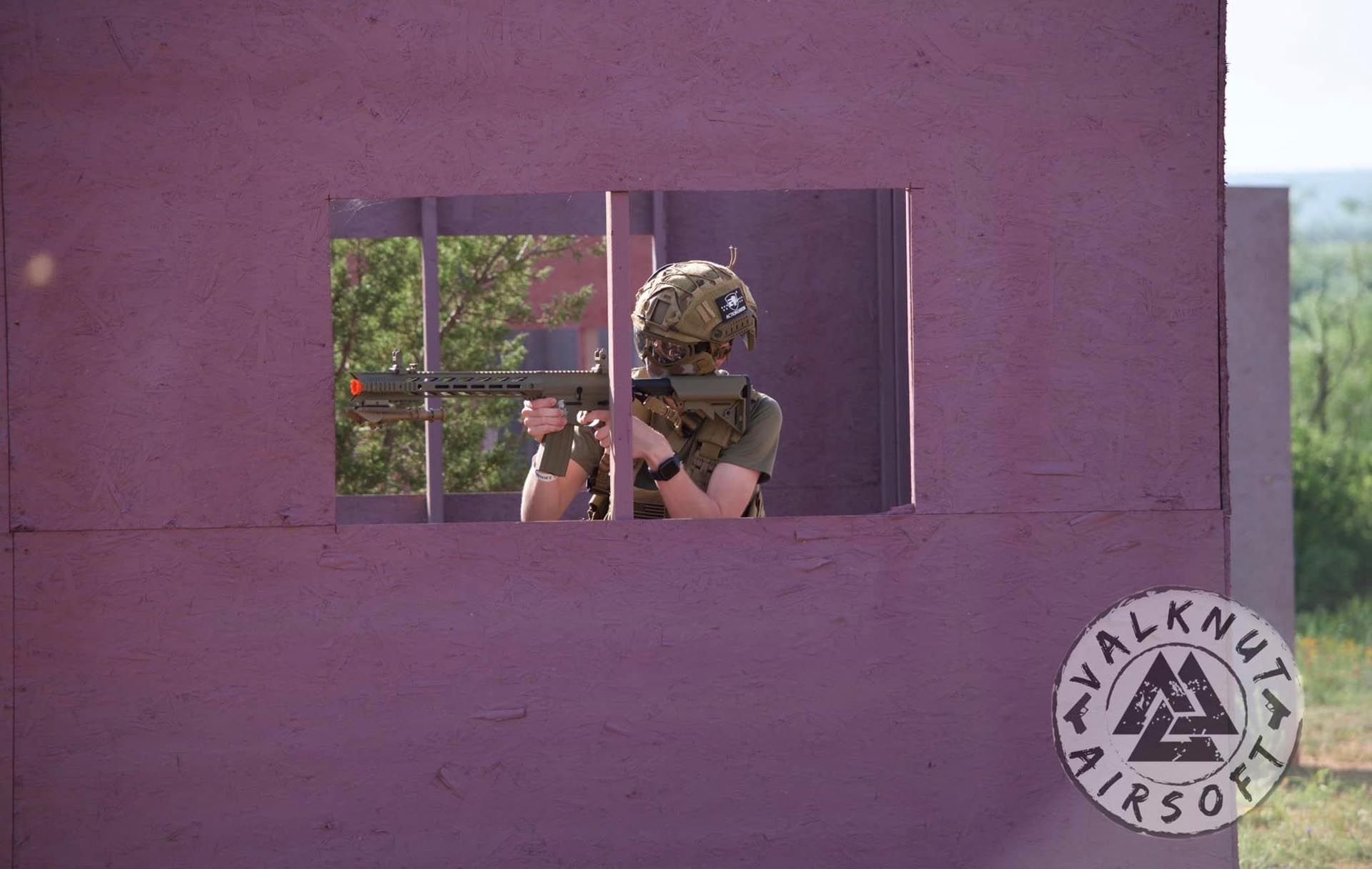 Airsoft player waiting at the window